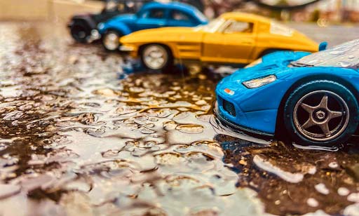 toy cars getting rained on - Spark Car Wash